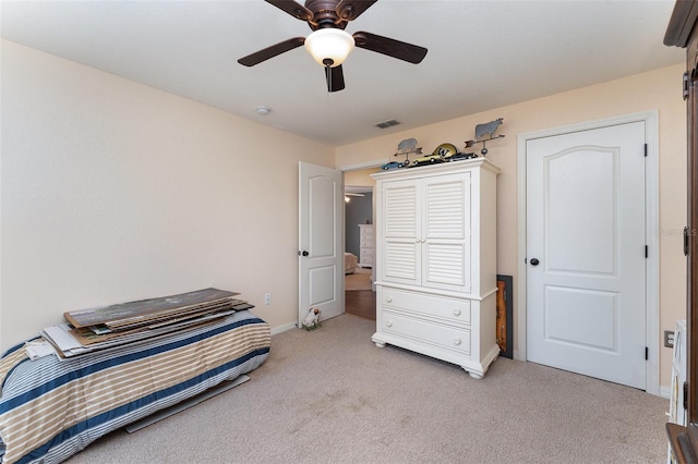 6789 Ashbury Dr, Lakeland, FL 33809 - bedroom with light carpet, baseboards, and ceiling fan