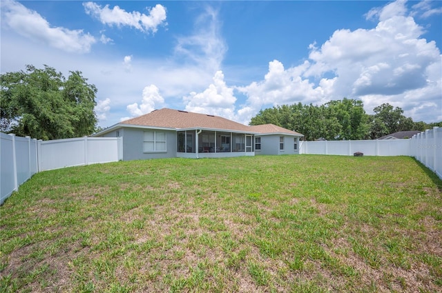 6789 Ashbury Dr, Lakeland, FL 33809 - back of house featuring a sunroom and stucco siding