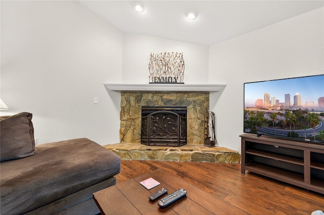 1922 Matthew Ct, Lakeland, FL 33813 - living room featuring wood finished floors and a stone fireplace