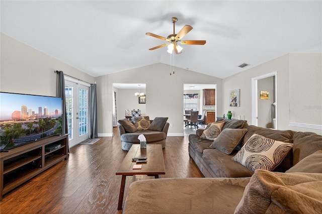 1922 Matthew Ct, Lakeland, FL 33813 - living room featuring vaulted ceiling, wood finished floors, ceiling fan, and a chandelier
