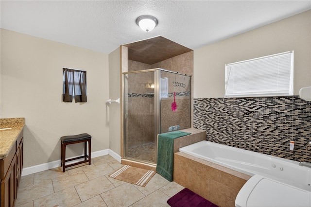 1922 Matthew Ct, Lakeland, FL 33813 - full bathroom featuring a bath, vanity, a shower stall, tile patterned flooring, and a textured ceiling