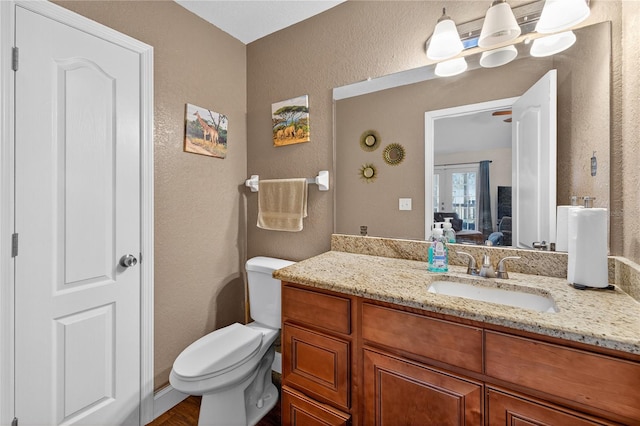 1922 Matthew Ct, Lakeland, FL 33813 - ensuite bathroom with a textured wall and vanity