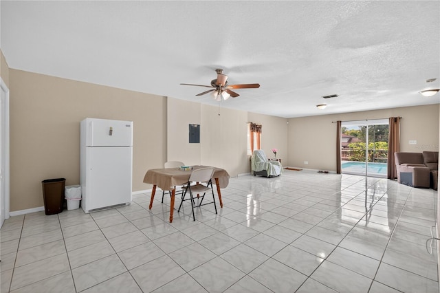 1922 Matthew Ct, Lakeland, FL 33813 - dining space with electric panel, ceiling fan, light tile patterned floors, and a textured ceiling