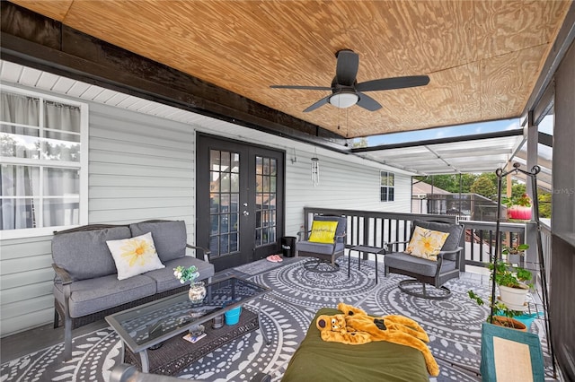 1922 Matthew Ct, Lakeland, FL 33813 - wooden deck with french doors, an outdoor hangout area, and a ceiling fan