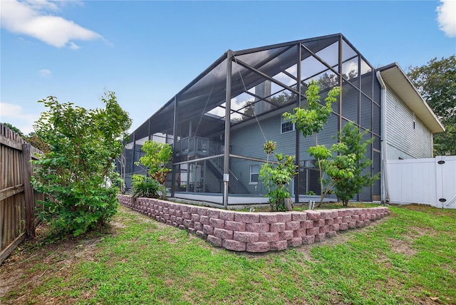 1922 Matthew Ct, Lakeland, FL 33813 - back of property with a lanai, a fenced backyard, and a patio
