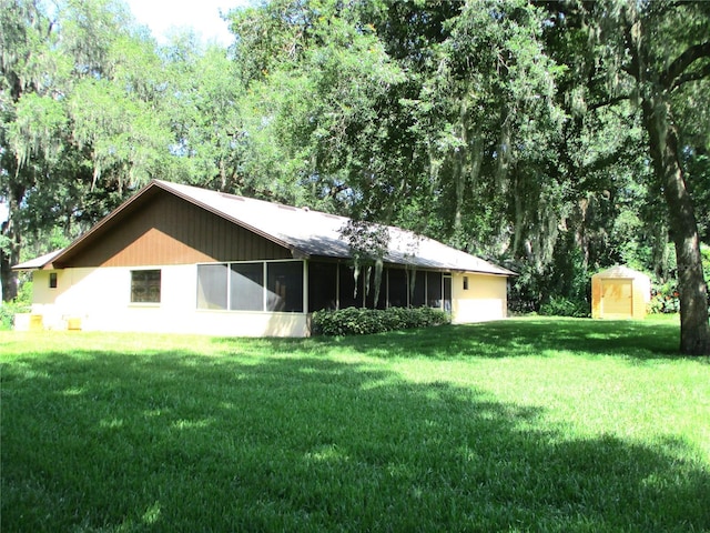 5070 Ironwood Trl, Bartow, FL 33830 - rear view of property featuring a lawn and a sunroom
