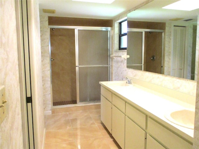 5070 Ironwood Trl, Bartow, FL 33830 - bathroom with double vanity, a stall shower, tile patterned flooring, and a closet