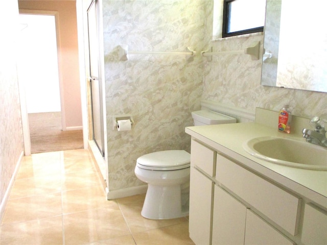 5070 Ironwood Trl, Bartow, FL 33830 - bathroom featuring toilet, vanity, a stall shower, baseboards, and tile patterned floors
