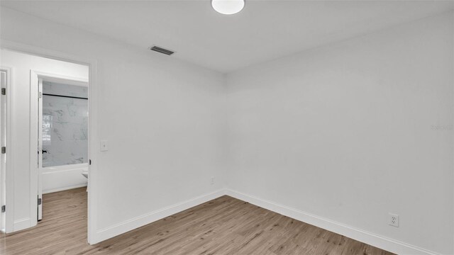 408 Sycamore St SW, Fort Meade, FL 33841 - unfurnished room with baseboards and light wood-style floors