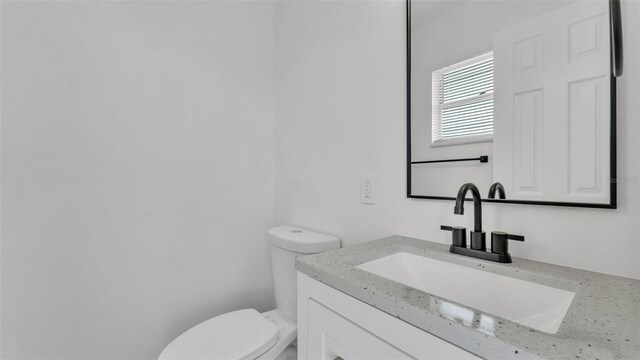 408 Sycamore St SW, Fort Meade, FL 33841 - bathroom with toilet and vanity