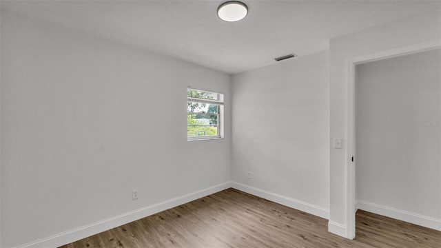 408 Sycamore St SW, Fort Meade, FL 33841 - unfurnished bedroom featuring light wood finished floors and baseboards