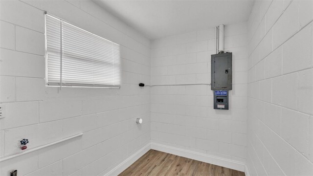 408 Sycamore St SW, Fort Meade, FL 33841 - bathroom featuring electric panel and wood finished floors