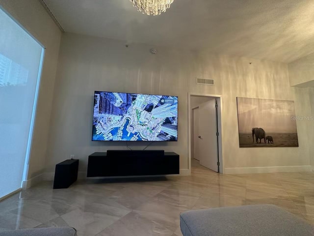 600 NE 27th St Unit 604, Miami, FL 33137 - living area with a chandelier and baseboards
