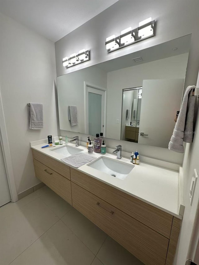 600 NE 27th St Unit 604, Miami, FL 33137 - bathroom with double vanity and tile patterned floors