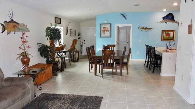 550 Patton Loop, Bartow, FL 33830 - dining area featuring light tile patterned floors, lofted ceiling, baseboards, and recessed lighting