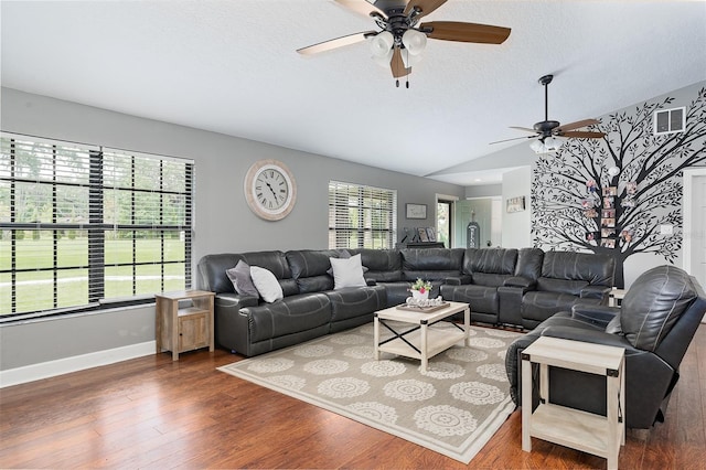 2331 D R Bryant Rd, Lakeland, FL 33810 - living room with a ceiling fan, wood finished floors, baseboards, a textured ceiling, and vaulted ceiling