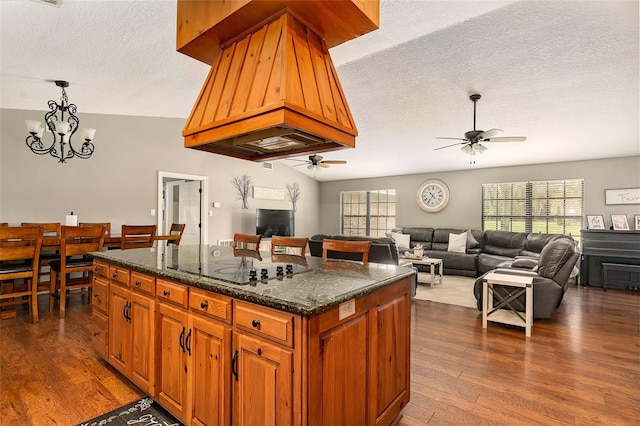 2331 D R Bryant Rd, Lakeland, FL 33810 - kitchen with a textured ceiling, ceiling fan, plenty of natural light, dark wood-style flooring, and a center island
