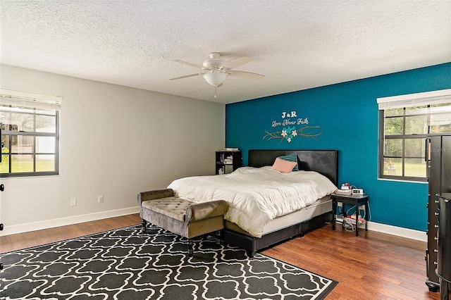 2331 D R Bryant Rd, Lakeland, FL 33810 - bedroom with wood finished floors, baseboards, a ceiling fan, and a textured ceiling