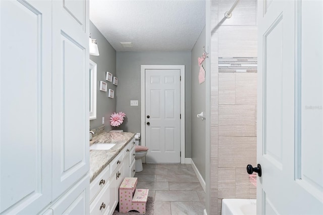 2331 D R Bryant Rd, Lakeland, FL 33810 - full bath with vanity, a textured ceiling, toilet, marble finish floors, and baseboards
