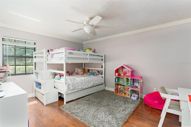 2331 D R Bryant Rd, Lakeland, FL 33810 - bedroom featuring ornamental molding, wood finished floors, baseboards, ceiling fan, and a textured ceiling