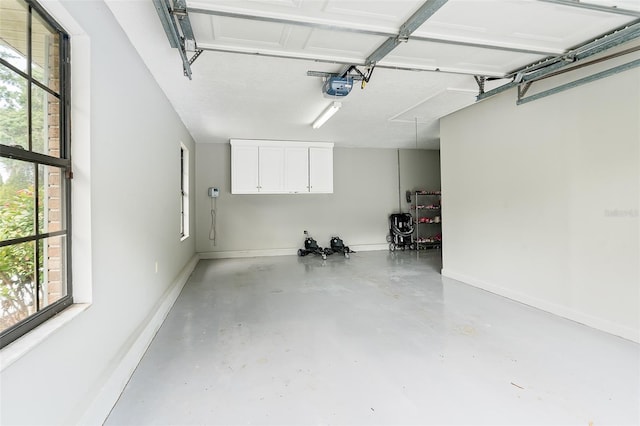 2331 D R Bryant Rd, Lakeland, FL 33810 - garage with a garage door opener and baseboards