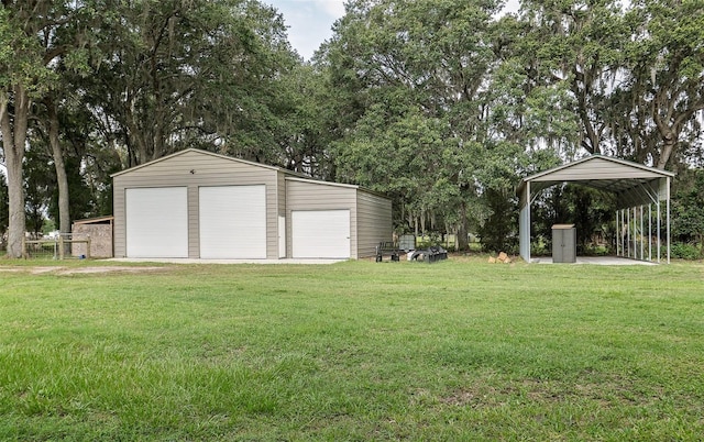 2331 D R Bryant Rd, Lakeland, FL 33810 - view of grassy yard with a garage, an outbuilding, and view of scattered trees