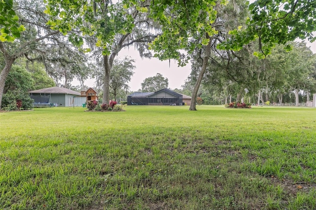 2331 D R Bryant Rd, Lakeland, FL 33810 - view of grassy yard featuring glass enclosure