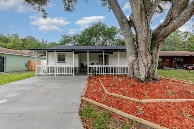 113 Patrick Henry Rd, Bartow, FL 33830 - ranch-style home with a porch, driveway, and roof with shingles
