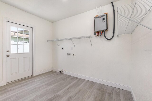 113 Patrick Henry Rd, Bartow, FL 33830 - washroom featuring electric dryer hookup and light wood-type flooring