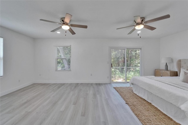113 Patrick Henry Rd, Bartow, FL 33830 - bedroom featuring multiple windows, access to exterior, light wood-style flooring, and ceiling fan