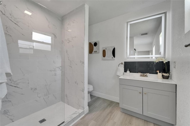 113 Patrick Henry Rd, Bartow, FL 33830 - bathroom with a marble finish shower, vanity, and wood finished floors