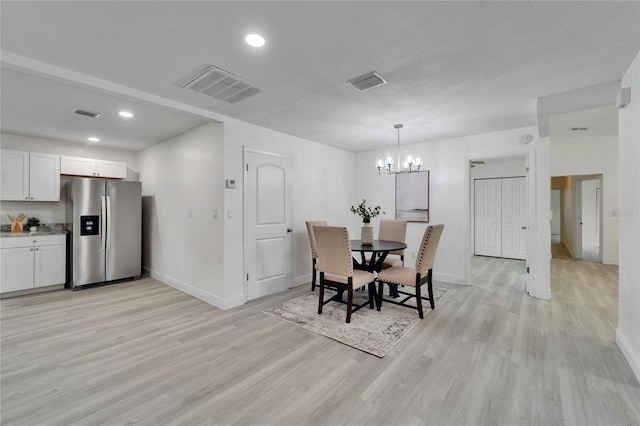 113 Patrick Henry Rd, Bartow, FL 33830 - dining room with light wood-style floors, a chandelier, and recessed lighting