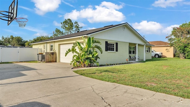 934 Point View Ln, Lakeland, FL 33813 - view of front facade featuring driveway, an attached garage, brick siding, and a gate