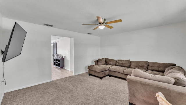 934 Point View Ln, Lakeland, FL 33813 - living area with light carpet, a ceiling fan, and baseboards