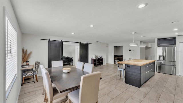 934 Point View Ln, Lakeland, FL 33813 - dining room with a barn door and recessed lighting