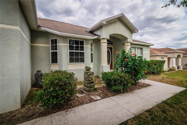 8323 Greystone Dr, Lakeland, FL 33810 - view of front of house featuring stucco siding