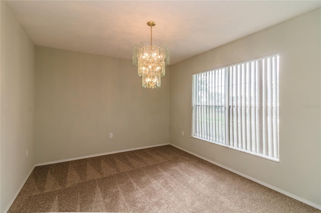 8323 Greystone Dr, Lakeland, FL 33810 - unfurnished room with carpet, a chandelier, and baseboards
