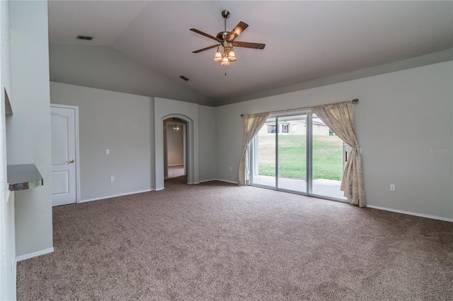 8323 Greystone Dr, Lakeland, FL 33810 - carpeted empty room with vaulted ceiling, a ceiling fan, arched walkways, and baseboards
