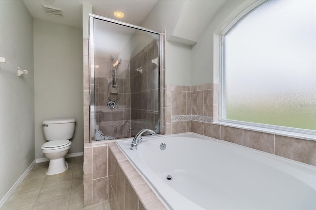 8323 Greystone Dr, Lakeland, FL 33810 - full bath with toilet, a bath, a stall shower, tile patterned floors, and baseboards