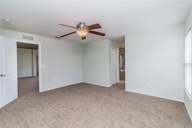 8323 Greystone Dr, Lakeland, FL 33810 - empty room featuring carpet, a ceiling fan, baseboards, and a smoke detector