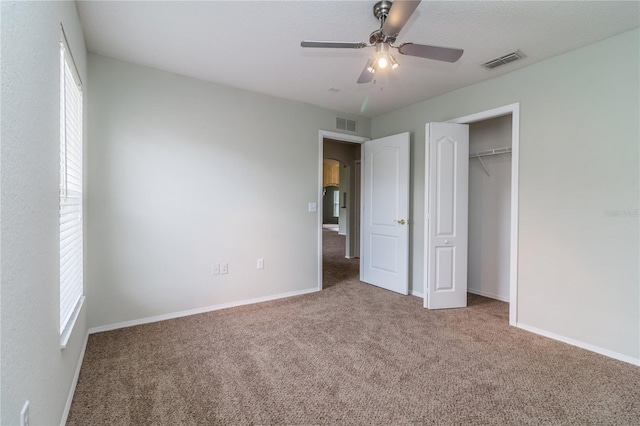 8323 Greystone Dr, Lakeland, FL 33810 - unfurnished bedroom with carpet flooring, multiple windows, and baseboards