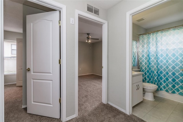 8323 Greystone Dr, Lakeland, FL 33810 - bathroom featuring vanity, baseboards, ceiling fan, and toilet