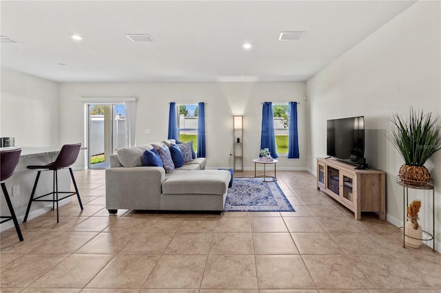1371 Madison Cir, Haines City, FL 33844 - living area featuring plenty of natural light, recessed lighting, light tile patterned flooring, and baseboards