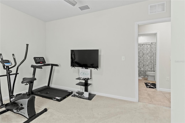1371 Madison Cir, Haines City, FL 33844 - exercise area featuring carpet flooring, baseboards, and tile patterned flooring
