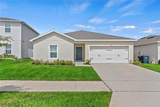 1371 Madison Cir, Haines City, FL 33844 - view of front facade with a garage, driveway, a front lawn, and stucco siding