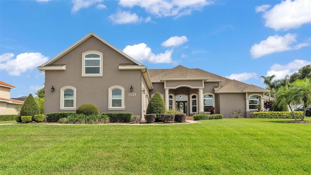 3121 Highlands By The Lake Way, Lakeland, FL 33812 - mediterranean / spanish-style house featuring stucco siding and a front lawn