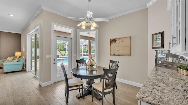 3121 Highlands By The Lake Way, Lakeland, FL 33812 - dining room featuring ceiling fan, ornamental molding, light wood-style flooring, and recessed lighting