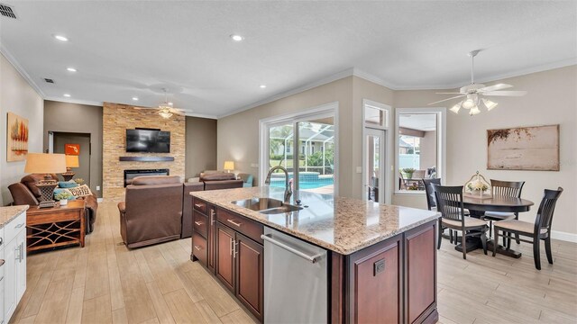 3121 Highlands By The Lake Way, Lakeland, FL 33812 - kitchen with a ceiling fan, dishwasher, ornamental molding, light wood finished floors, and recessed lighting