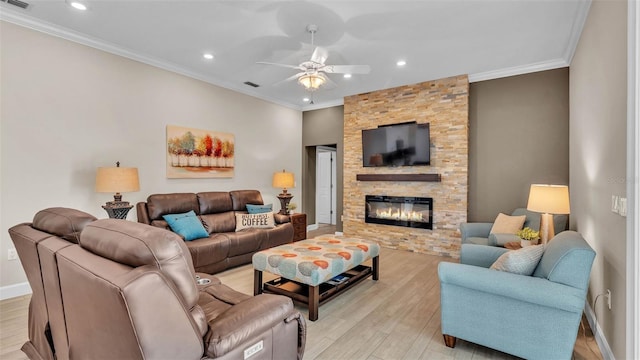 3121 Highlands By The Lake Way, Lakeland, FL 33812 - living area with ceiling fan, light wood finished floors, recessed lighting, a fireplace, and ornamental molding