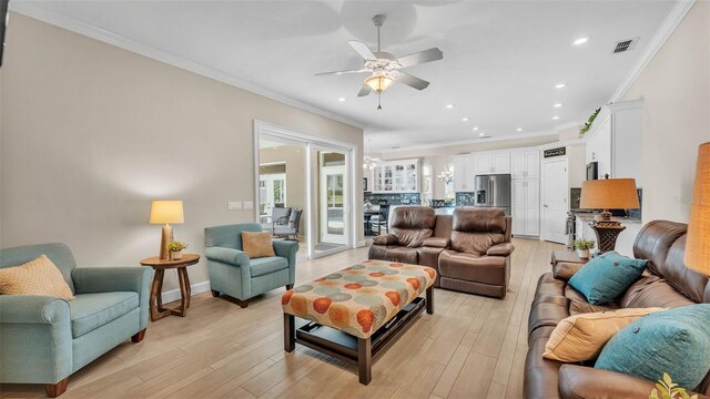 3121 Highlands By The Lake Way, Lakeland, FL 33812 - living room with a ceiling fan, ornamental molding, light wood-type flooring, and recessed lighting